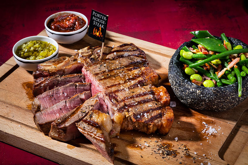 Sliced steak on a wooden board